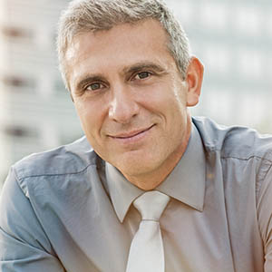 A man smiles as his thinks about general dentistry specials at Lovett Dental in Webster, TX