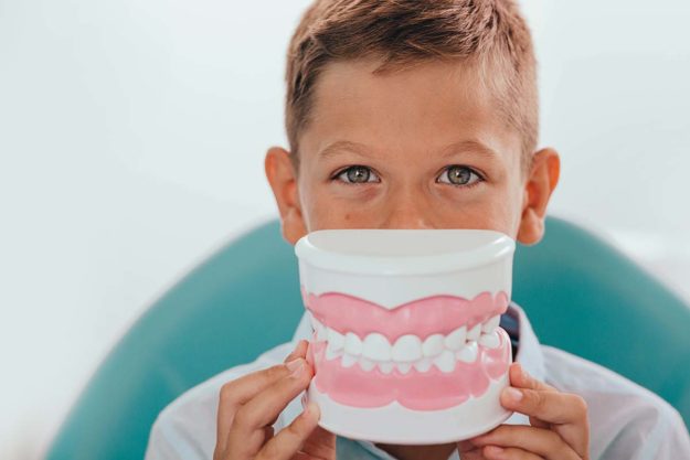 young boy happy after Vital Pulp Therapy