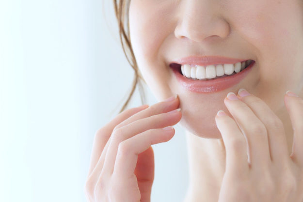 woman wondering how to prevent teeth shifting