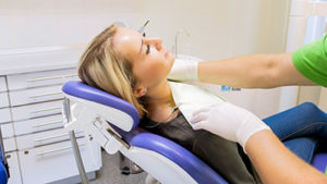 a woman receives treatment from at houston sedation dentist