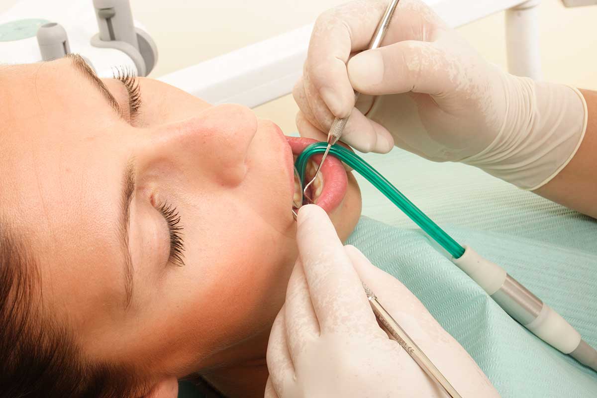 a woman gets treatment for a dental emergency