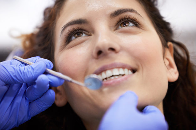 woman receiving dental health services in texas