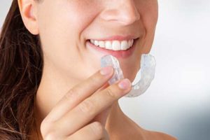 woman using clear aligners